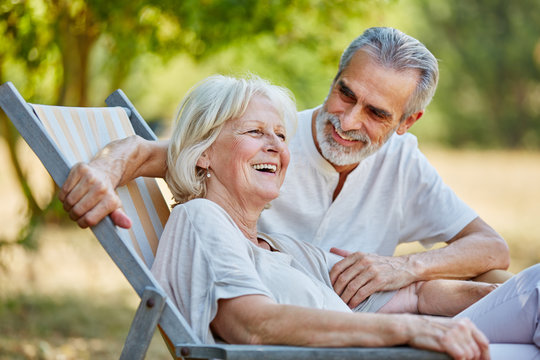 Senior couple laughing in summer