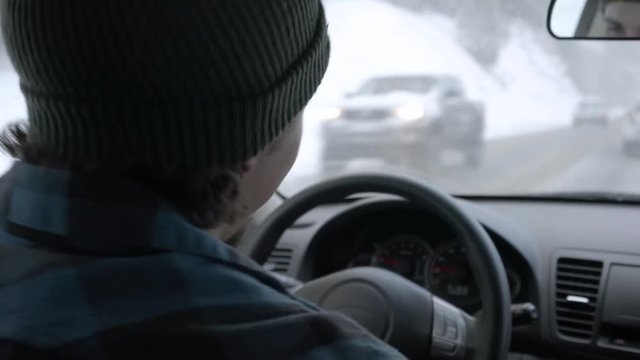 Young Woman Turns Up The Music In The Car, Her Boyfriend Dances, She Tries To, But Her Beanie Falls Over Her Eyes, Funny