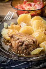 Stewed pork meat served with potatoes