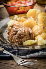 Stewed pork meat served with potatoes