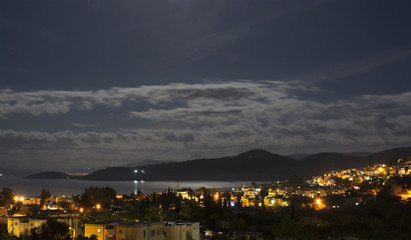 Long exposure image of Turkbuku village by Aegean sea in Bodrum peninsula in southwestern Turkey. It is full moon in summer 2016.