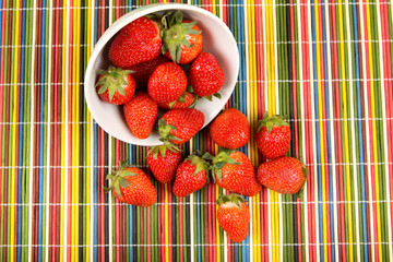 Ripe strawberry on a wooden background
