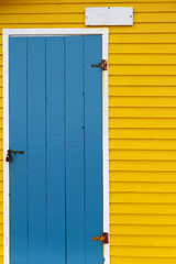 Brightly colored wooden door and wall