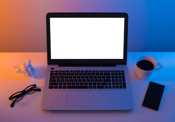 Fototapeta premium Colorful workplace - laptop computer with blank screen