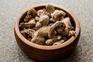 Dry Ginger in wooden bowl.