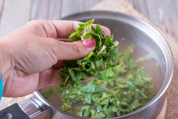 Add greens to the soup