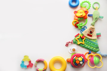 Fototapeta na wymiar Children's toys and accessorieson a White background.view from above