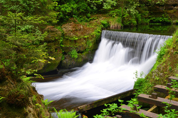 Waterfall on the river Kamenice in the National park Czech Switzerland, Czech Republic.