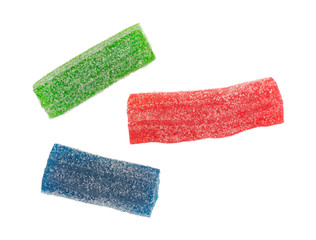 Sugar coated gummy sweet and sour candy in several flavors isolated on a white background.