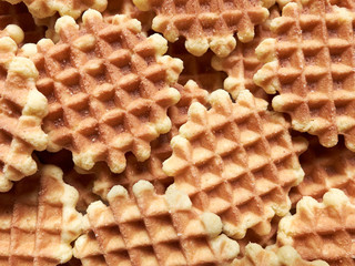Fresh round waffles ready to be eaten.