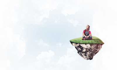 Concept of careless happy childhood with girl dreaming about som