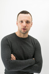 Fototapeta premium Talking young European man over white wall