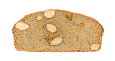 Almond pistachio crisp bread slice top view isolated on a white background.