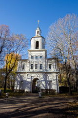 Gate belltower, entrance to the estate of Bobrinsky Counts at autumn trees