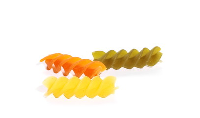 Colorful Italian spiral shaped pasta, macaroni, isolated on white background, top view