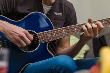 Fototapeta na wymiar Student Plays Guitar