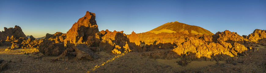 Teide volcano in Tenerife, volcanic rocks in the red light of the rising sun