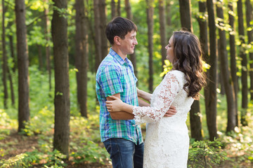 Portrait of a young romantic couple embracing each other on nature