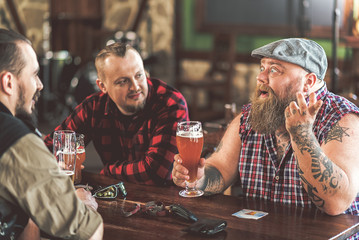 Men drinking beer in a bar