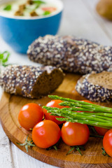 Fresh asparagus, bread and tomatoes