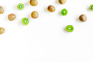 exotic fruit mockup with sliced kiwi on white table background top view