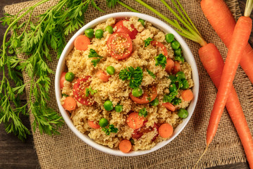 Overhead photo of vegetable coucous dish with fresh carrots