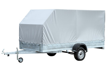 Spacious grey car trailer, isolated on white background.