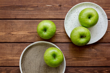 ripe green apples wooden table background top view