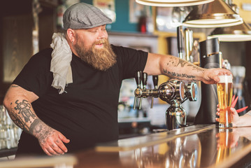 Bartender handing over a drink