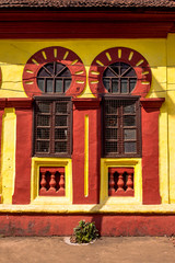 yellow and red building with windows
