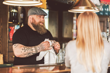 Bartender speaking with customer