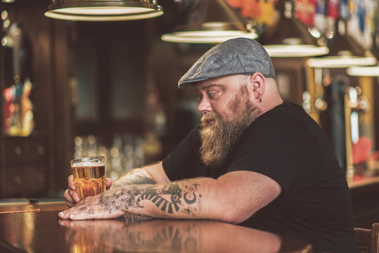 Man drinking a beer in a bar