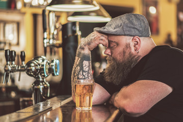 Man sitting in pub thoughtfully