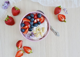 Yogurt with berries and cashew, healthy breakfast