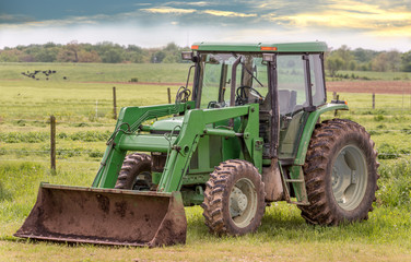 Tractor in a field on a rural Maryland farm during Spring