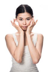 Portrait of Asian young woman looking at camera with an intelligent facial expression