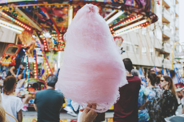 young woman with cotton candy at the party