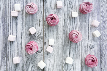 Pink berry zephyr and flower in box on grey wooden background