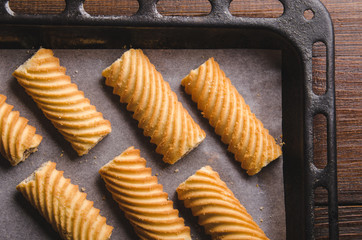 Homemade sweet cookies on a baking sheet. closeup