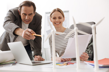 Positive colleagues working on the project of eco turbines