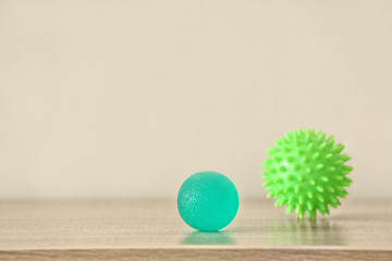 Two rubber balls on light background