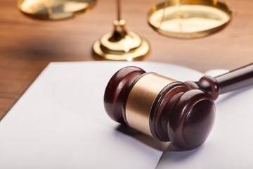 Wooden gavel on book.