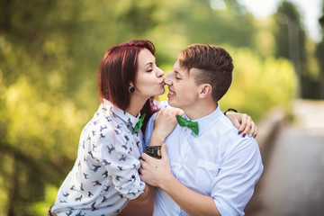 Woman kisses man to nose, young couple in love