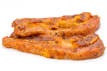 Spicy marinated spare ribs barbecued on the white background.