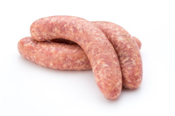 Raw sausage with parsley leaf isolated on white background.