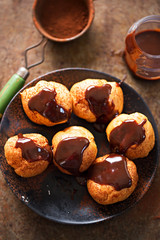 Chocolate cream profiteroles with cocoa