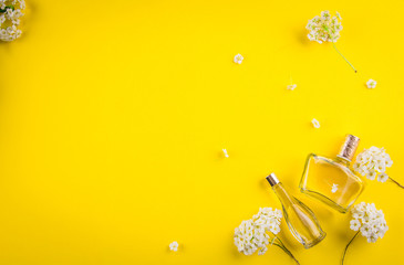 Bottles of perfume with flowers