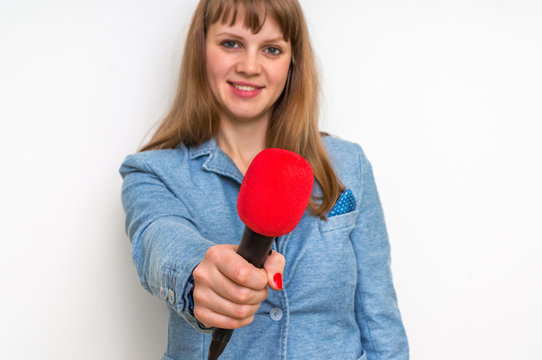 Female reporter with red microphone making interview