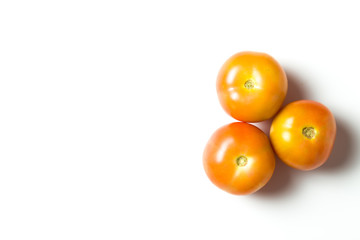 A group of tomatoes isolated over white background