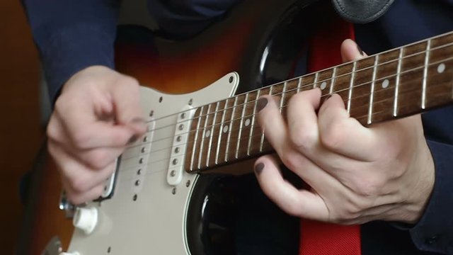 Man playing solo on electric guitar